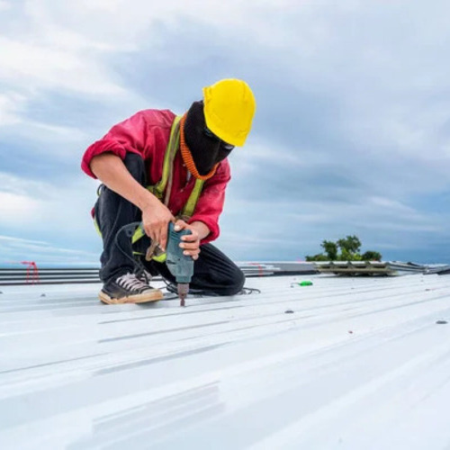 worker on a commercial roof