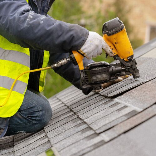 worker on a residential roof